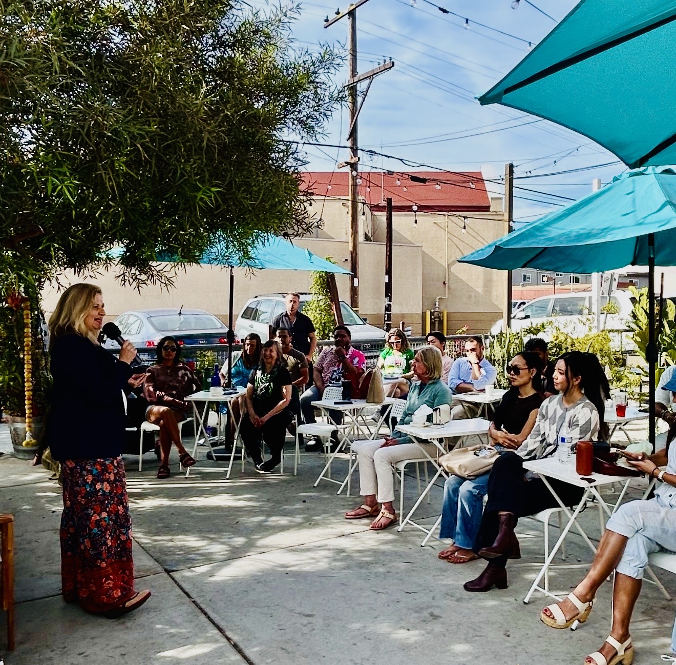 Shannon C. Rose speaking at an outdoor gathering