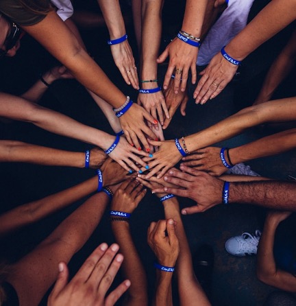 Team hands joined together